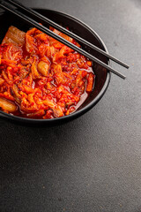Kimchi pickled cabbage salad spicy savory vegetables fresh delicious gourmet food background on the table rustic food top view copy space vegetarian and vegan food