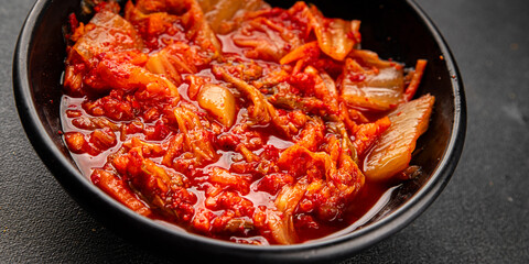 Kimchi pickled cabbage salad spicy savory vegetables fresh delicious gourmet food background on the table rustic food top view copy space vegetarian and vegan food