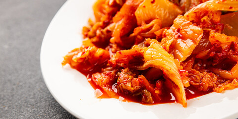 Kimchi pickled cabbage salad spicy savory vegetables fresh delicious gourmet food background on the table rustic food top view copy space vegetarian and vegan food