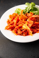 Kimchi pickled cabbage salad spicy savory vegetables fresh delicious gourmet food background on the table rustic food top view copy space vegetarian and vegan food