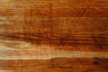 scratched wooden cutting board surface