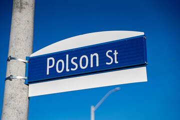 View of Polson Street sign on pole in Toronto.