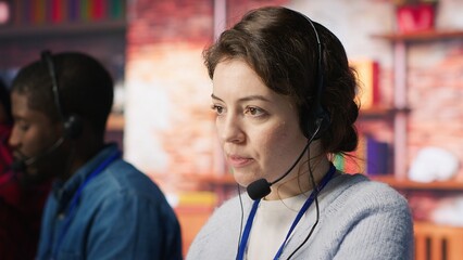 Call center worker using artificial intelligence customer service management software. Customer...