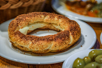 Turkish simit served with cheese at a restaurant for breakfast, Istanbul, Turkey