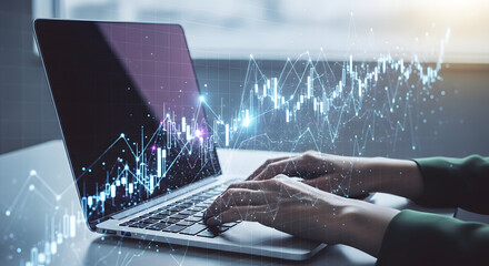 Hands typing on a laptop with financial graph overlays, representing data analysis and market trends.
