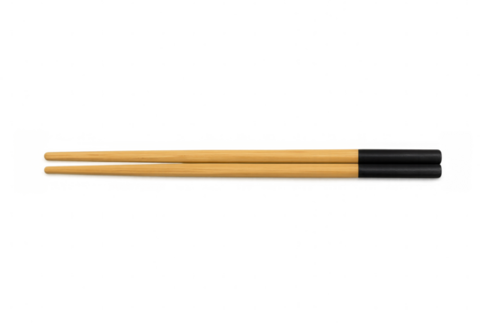 Pair of wooden chopsticks with black tips lying horizontally on a transparent background, ready for use in asian cuisine