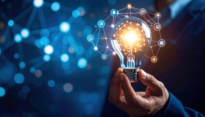 Businessman holding a glowing light bulb symbolizing innovation and new ideas with digital network connections