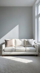 Fototapeta premium Minimalist living room interior with a white sofa and natural window light
