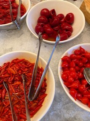 Chili Pepper Bowls on Ice: Assorted chili peppers served in bowls over ice, symbolizing customizable heat and flavor intensity