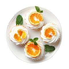 Four orange-topped cupcakes on a white plate, garnished with fresh mint leaves
