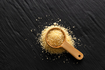 Crumbs scattered - Spoonful of yellow panko crumbs