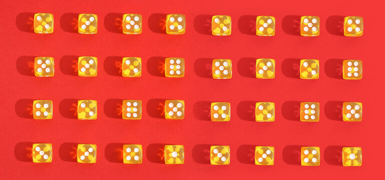 Yellow dices on red background. Pattern for design