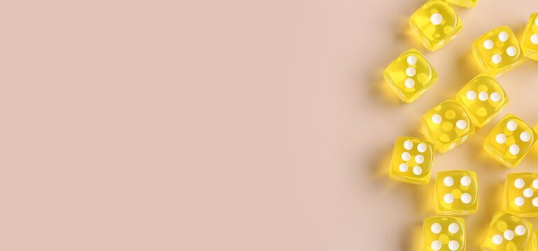 Many dices on beige background with space for text