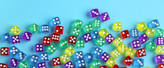 Many dices on blue background, top view