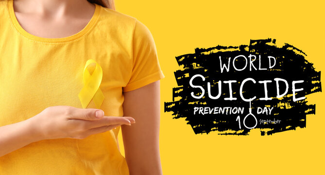Woman with yellow awareness ribbon on color background, closeup - Powered by Adobe
