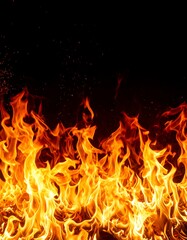 Fiery flames against black background