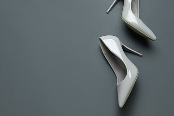 Stylish high heels on grey background