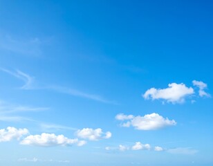 Obraz premium Clear blue sky with scattered white clouds