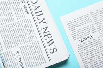 Obraz premium Different newspapers on blue background