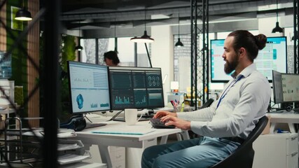 Professional consultant reviewing financial data forecast on pc screen, developing innovative business solutions for alignment with enterprise objectives. Corporate industry strategy. Camera A.