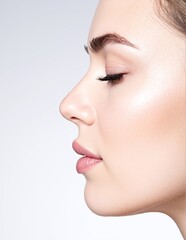 A woman with flowing, long hair elegantly styled, accentuated by bold black eyeliner that enhances her striking eyes, exuding confidence and allure.