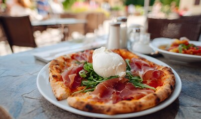 Prosciutto burrata pizza on a table in Verona