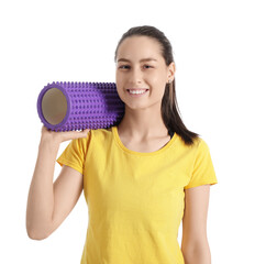 Sporty young woman with foam roller on white background