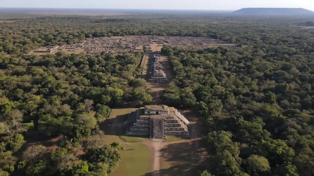 An aerial perspective showcases the ancient temple ruins of koh ker, cambodia, with its pyramid structure and surrounding jungle, revealing a historical and archaeological treasure