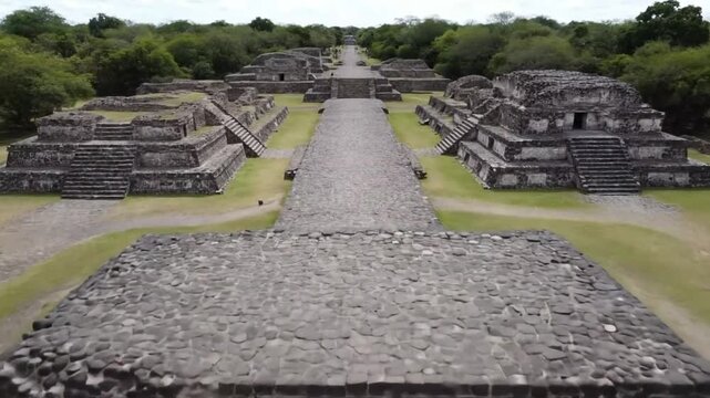 An aerial view captures the ancient pyramids and structures of an archaeological site, revealing the rich history and cultural heritage of a prehispanic civilization