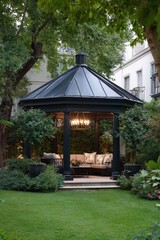 Elegant black gazebo in lush garden