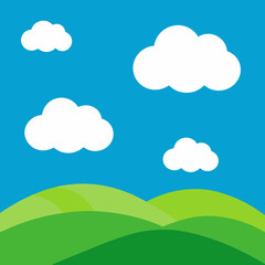 Obraz premium Vibrant green hills under a bright blue sky with fluffy white clouds
