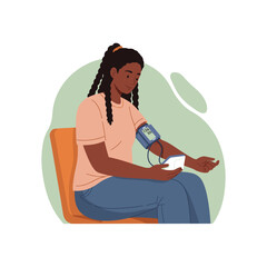 A woman measures her blood pressure with a blood pressure monitor