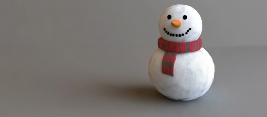 Charming snowman with a festive scarf standing against a neutral backdrop