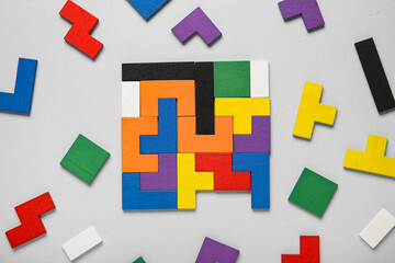 Many different colorful blocks on grey background. Logic concept