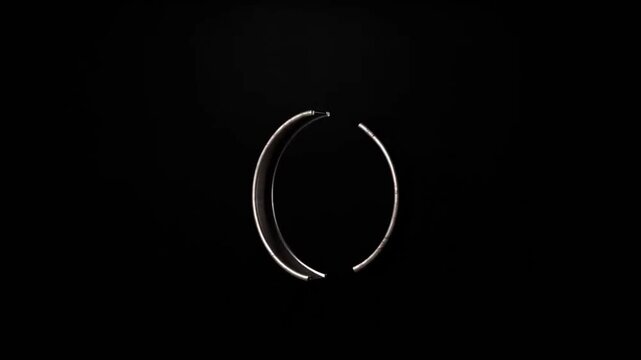 Embracing the Void: A minimalist composition showcases two elegant, metallic parentheses, delicately illuminated against the stark, velvety backdrop.