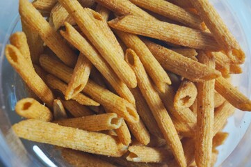 spicy snacks in plastic jars seen up close