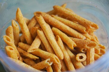 spicy snacks in plastic jars seen up close