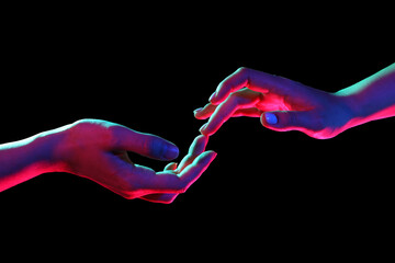 Toned female hands on dark background