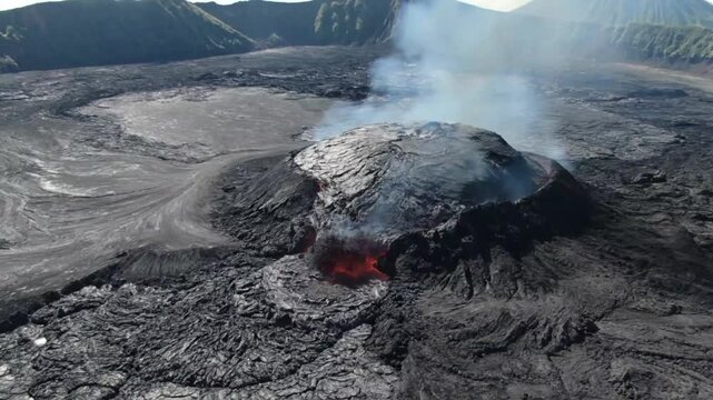 The piton de la fournaise volcano on reunion island erupts, showcasing a dramatic display of natures power with flowing lava and billowing smoke