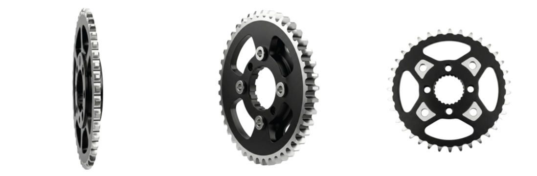 A complete set of a motorcycle rear chain sprocket shown from various angles, featuring a black center and steel teeth isolated on a white background.