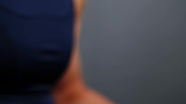 Clinical examination scene focusing on stretched shiny skin on upper arm affected by systemic sclerosis.