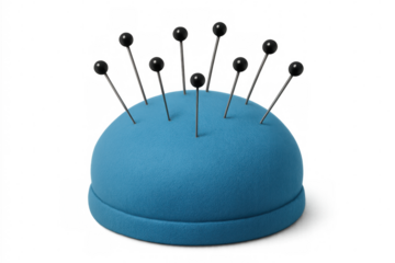 Metallic sewing pins piercing soft blue pincushion, highlighting precision crafting tools against clean transparent backdrop