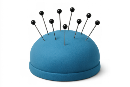 Metallic sewing pins piercing soft blue pincushion, highlighting precision crafting tools against clean transparent backdrop