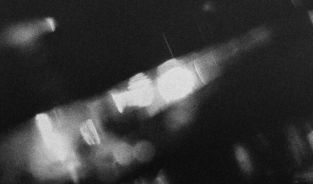 retro film overlay effect with scratch dust and light leaks, retro grain noisy film distressed texture light leak flare on black background, Black and white background