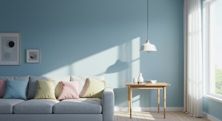 A minimalist interior with a light blue wall, gray couch with colorful pillows, wooden table, framed art, and natural light