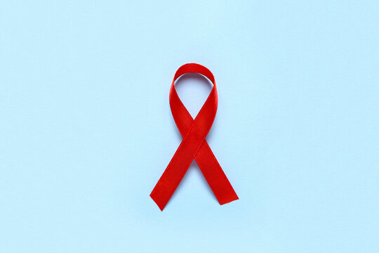 Red ribbon on blue background. Blood Cancer Awareness Month - Powered by Adobe