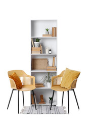 Armchairs with rug, shelving unit and different decor on white background