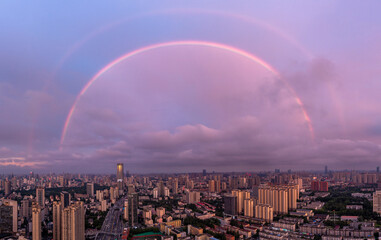 rainbow over city