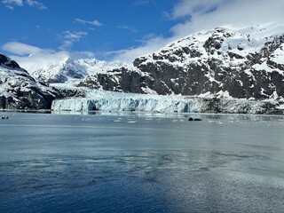 Snow-Capped Mountains and Glacier Reflected in Icy Waters
