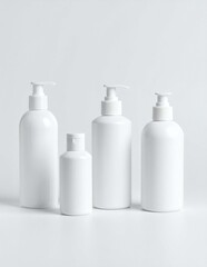 Set of white blank cosmetic pump bottles and flip-top bottle mockup